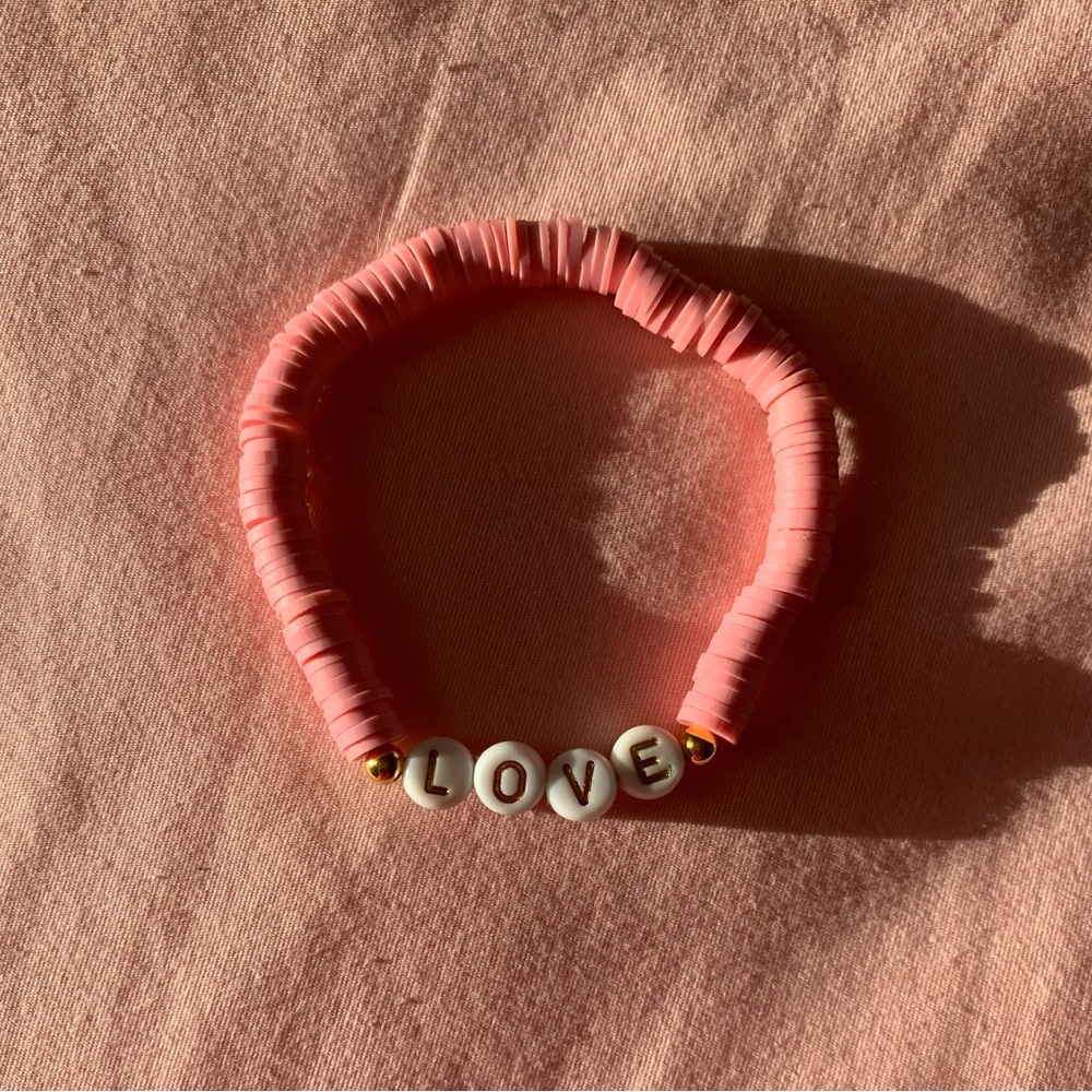 This bracelet is called love and it’s colors are pink and it was homemade!